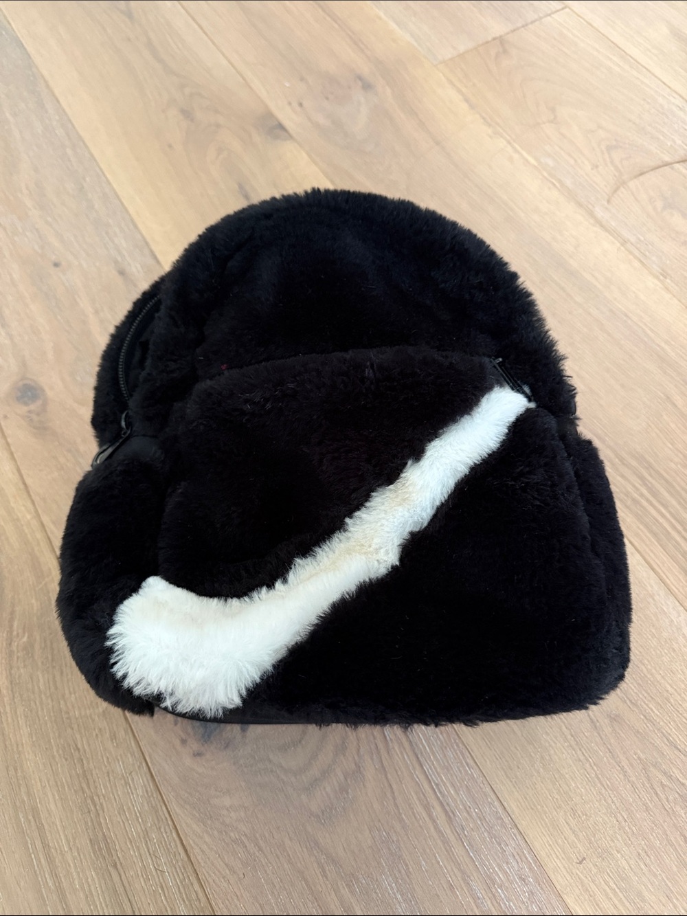 Cozy Black Faux Fur Backpack with White Swoosh